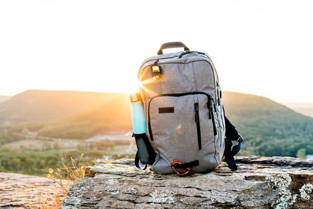 Reference image — a trekking daypack on a mountain ridge